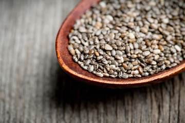 Chia seeds on the wooden table. Selective focus. shallow depth of field.