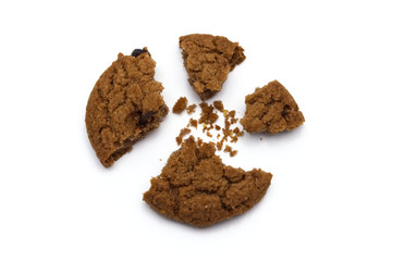 Biscuit with chocolate chip flavored. Some broken and crumbs of crunchy delicious sweet meal and useful cookie with on white background.