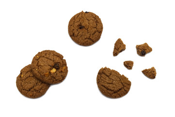 Fototapeta na wymiar Biscuit with chocolate chip flavored. Some broken and crumbs of crunchy delicious sweet meal and useful cookie with isolated on white background.