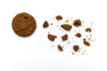 Biscuit with chocolate chip flavored. Some broken and crumbs of crunchy delicious sweet meal and useful cookie with on white background.