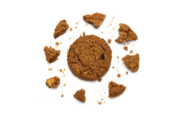 Biscuit with chocolate chip flavored. Some broken and crumbs of crunchy delicious sweet meal and useful cookie with on white background.