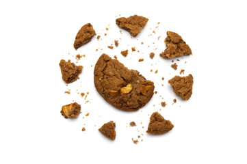 Biscuit with chocolate chip flavored. Some broken and crumbs of crunchy delicious sweet meal and useful cookie with on white background.
