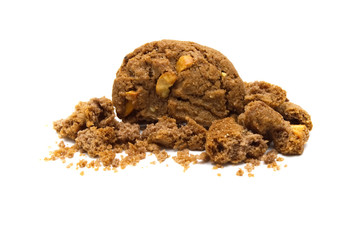 Biscuit with chocolate chip flavored. Some broken and crumbs of crunchy delicious sweet meal and useful cookie with on white background. Selective focus.