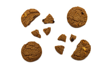 Biscuit with chocolate chip flavored. Some broken and crumbs of crunchy delicious sweet meal and useful cookie with isolated on white background.