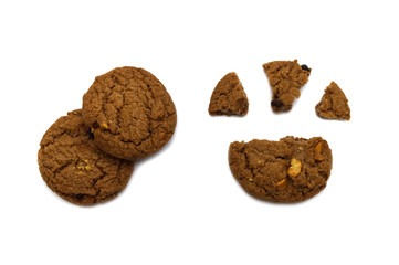 Biscuit with chocolate chip flavored. Some broken and crumbs of crunchy delicious sweet meal and useful cookie with isolated on white background.