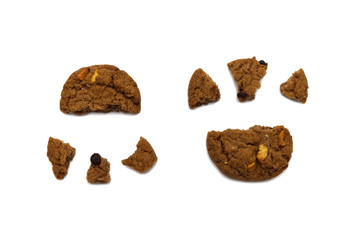 Biscuit with chocolate chip flavored. Some broken and crumbs of crunchy delicious sweet meal and useful cookie with isolated on white background.