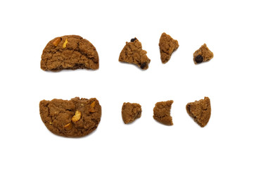 Biscuit with chocolate chip flavored. Some broken and crumbs of crunchy delicious sweet meal and useful cookie with isolated on white background.