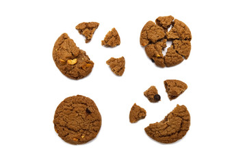 Biscuit with chocolate chip flavored. Some broken and crumbs of crunchy delicious sweet meal and useful cookie with isolated on white background.
