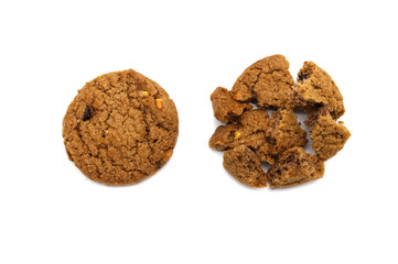 Biscuit with chocolate chip flavored. Some broken and crumbs of crunchy delicious sweet meal and useful cookie with isolated on white background.