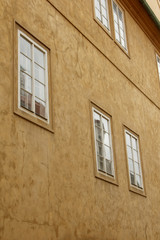 Prague, Czech Republic. 10.05.2019: Detail of the yellow facade of a historic building in the old...