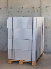 Packing aerated concrete blocks for partitions in a building under construction on a pallet