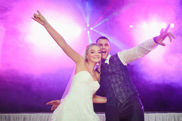 great party mood at the wedding - bride and groom celebrate