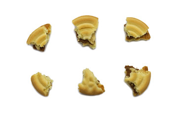 Sandwich cookies filled with coffee cream flavored. Some broken and crumbs of crunchy delicious sweet meal and useful cookie isolated on white background.