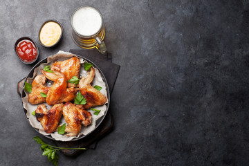 Hot chicken wings and draft beer