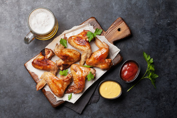 Hot chicken wings and draft beer