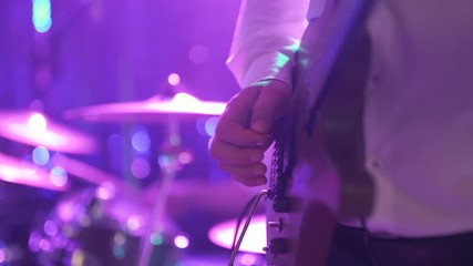 guitarist playing electric guitar at concert