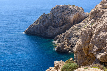 Rocky coast with blue sea. Cala Ratjada , north-east coast of Majorca. Spain