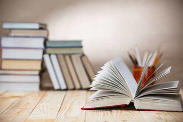 Textbooks and books on a wooden table