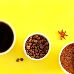 Three white cups with ground coffee, coffee beans and black brewed coffee in the rays of bright sunlight, sunset, dawn on a yellow background. Close-up, top view, flat lay, copy space for text.