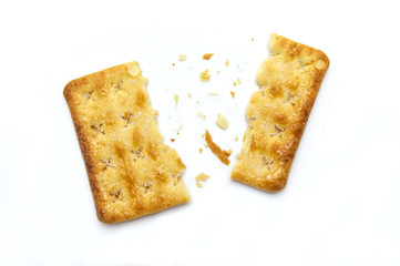 Broken square crackers biscuits isolated on white background. Crushed dry snack.