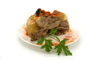 Traditional Romanian homemade pork trotter jelly dish called piftie. Jellied pork aspic made with pork meat served with paprika and fresh parsley.