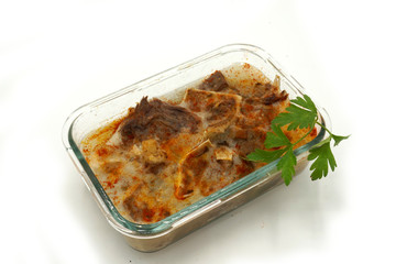 Traditional Romanian homemade pork trotter jelly dish called piftie. Jellied pork aspic made with pork meat served with paprika and fresh parsley.