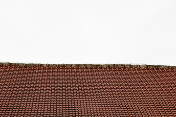 Prague. 05.10.2019: Low light detail of patina red roof top. Prague Lesser Town typical roofing material. Old roofing of clay tiles. Various orange shades and stains.