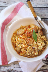 Regional Italian food. Piedmontese risotto with porcini mushrooms and sausages