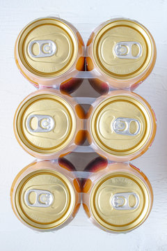 Top view of a golden can six pack of beer