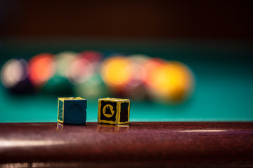 snooker chalk is on the billiard table