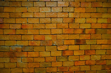 orange square brick block on cement wall textured and background. strong interiors house building