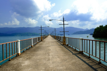 pier walk way cement bridge on sea. harbour in island for transportation.