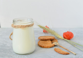 kefir, , yogurt, cereal cookies, mango, on a gray concrete background. Useful breakfast. Diet, weight loss, proper nutrition.