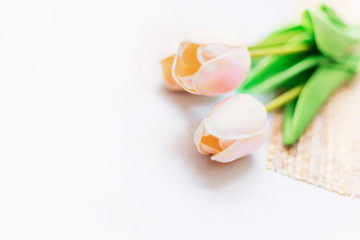 Fototapeta na wymiar Pink tulips flower on white marble with copy space, Valentine day