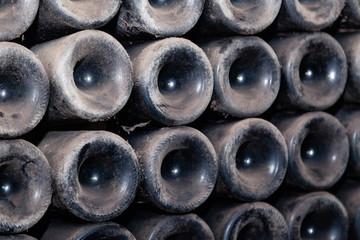pattern from bottoms of dusty wine bottles