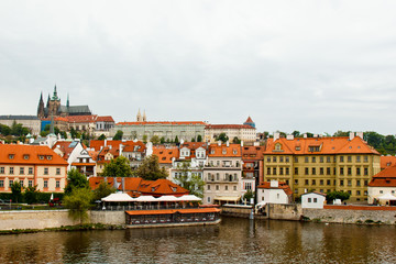 Prague. 05.10.2019: Orange colored roof tops of Prague old town buildings and baroque style houses viewed from top of old town hall tower, Prague, Czech Republic. Panorama.