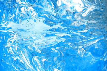Acrylic paint . Abstract art background, fluid acrylic painting on canvas. Backdrop blue color for your design .
