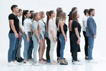 side view. a group of diverse young people standing in a row