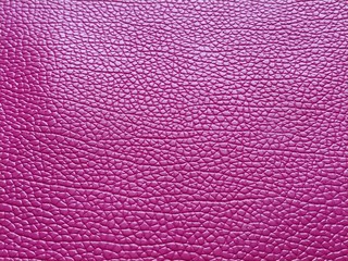 Artificial leather is bright pink or fuchsia. Distinct furrows and elevations on the surface of a...