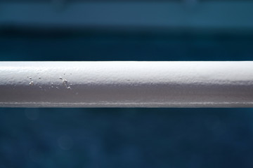 A bar from railing of a ship in a horizontal view