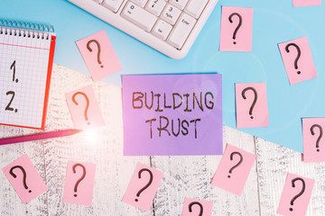 Conceptual hand writing showing Building Trust. Concept meaning activity of emerging trust between...