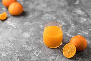 A freshly squeezed orange juice in a clear glass