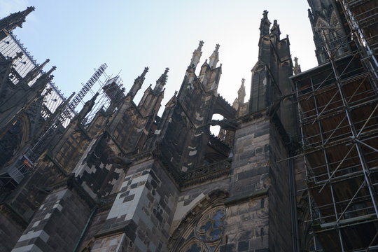 Reconstruction of ancient buildings. Medieval Heritage Conservation Concept. Exterior of gothic Cologne Cathedral of Saint Peter.