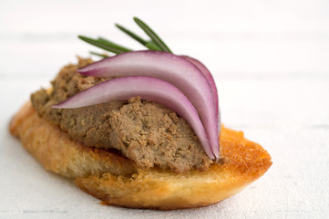 homemade meat pate on toasted crusty bread.