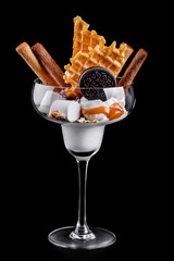 tasty vanilla ice cream poured with salt caramel with marshmallows waffles and chocolate chip...