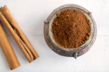 ground Ceylon cinnamon on a white background.