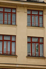 Prague, Czech Republic. 10.05.2019: Close-up view of the facade with windows of old historical buildings in Prague. Retro, old-fashioned, vintage, last century.
