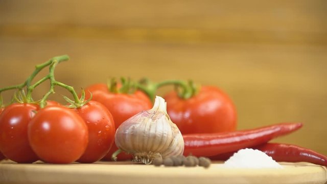 tomatoes, peppers and garlic on a tray