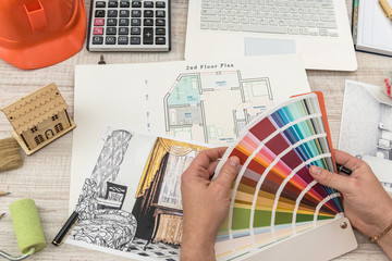 The designer chooses the perfect color for a new apartment. Sketch of a modern apartment.