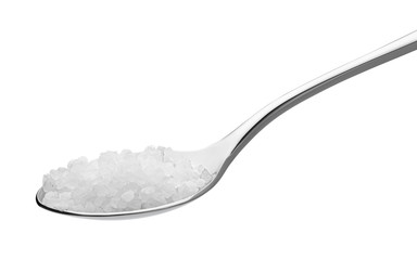 salt on a teaspoon isolated on white